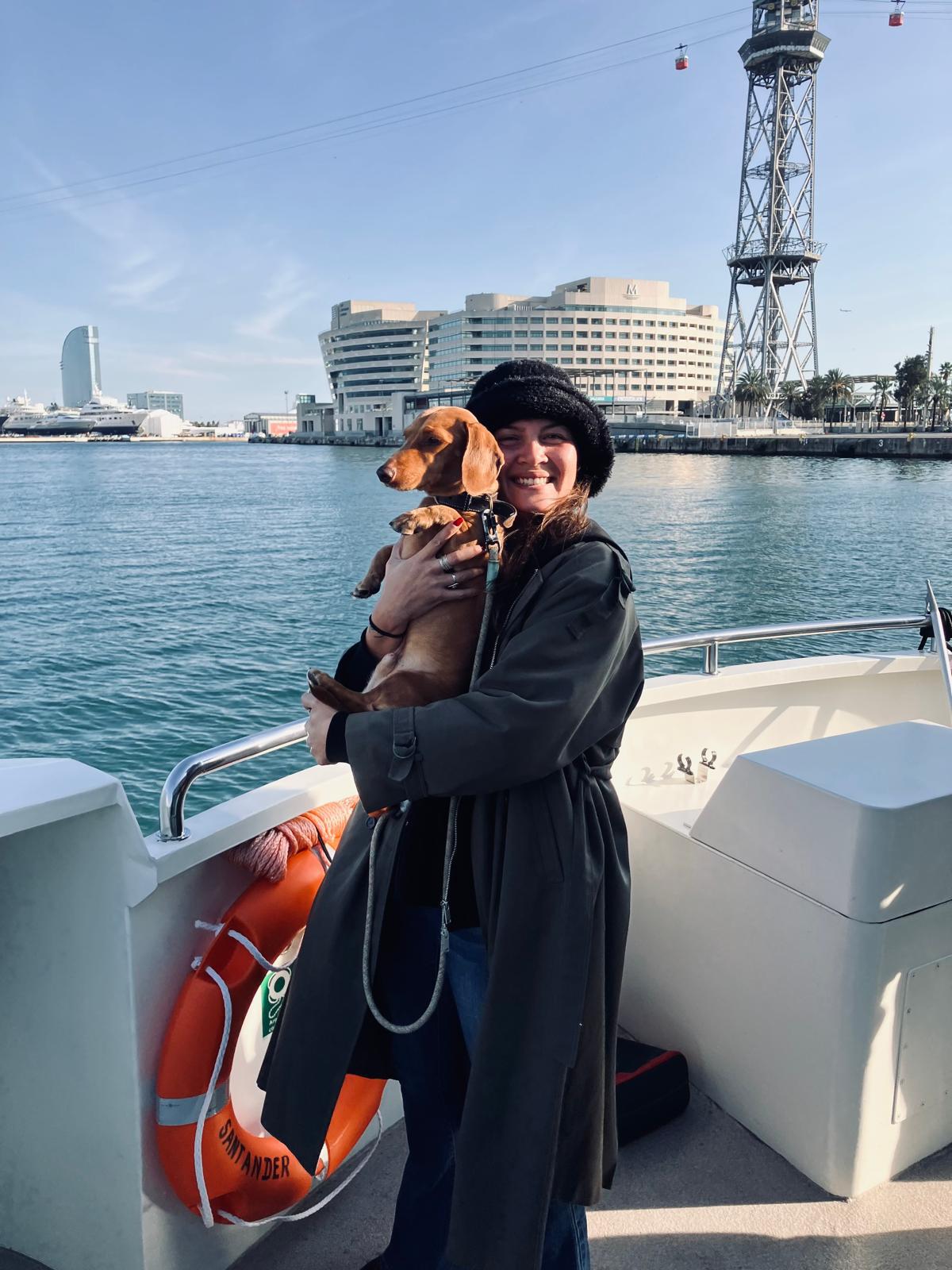 Andréa with dog on boat